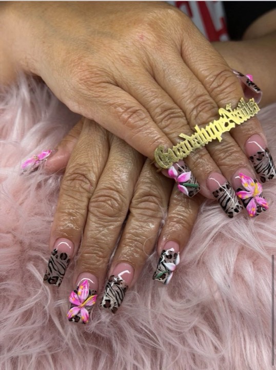 Coffin nails with zebra print, pink French tips and hand-painted hibiscus flowers