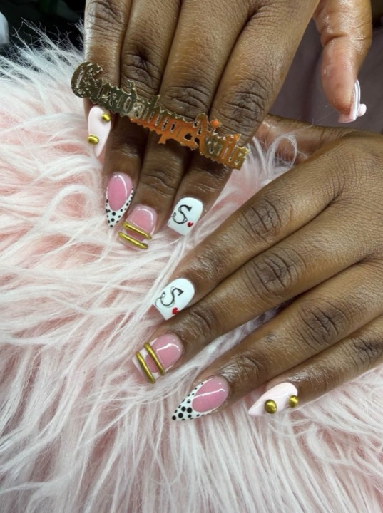 Short nails with pink, gold stripe, leopard and initial accents