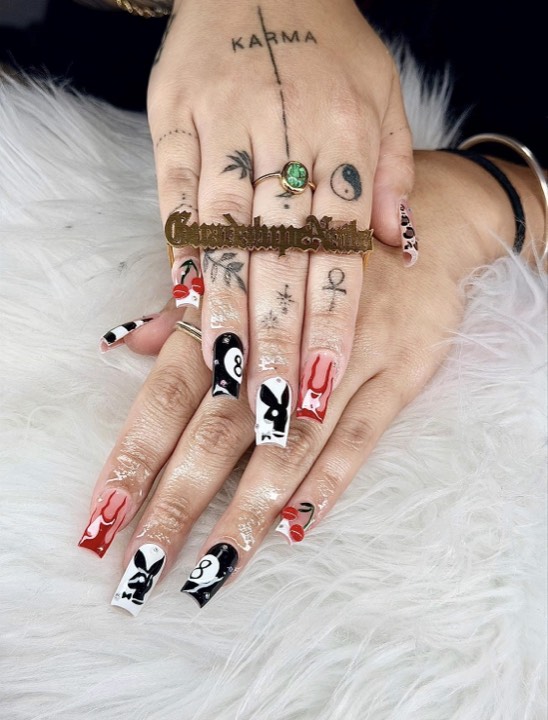 Coffin nails in red, black and white with bold graphic designs
