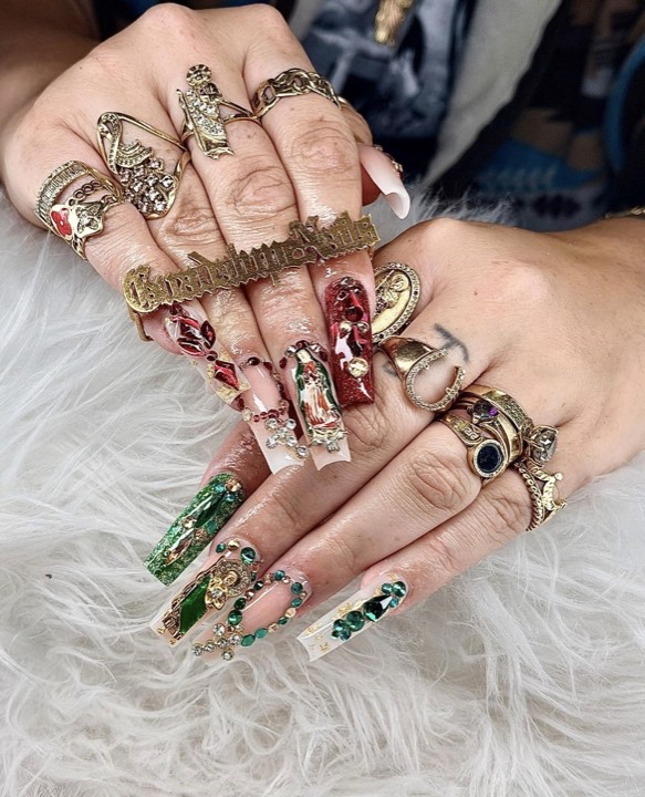 Long square acrylics with ornate gold charms and hand-painted deep red and emerald detail
