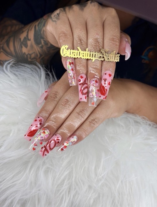 Long pink coffin nails with red heart and lip art