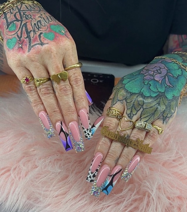 Long coffin nails in pink with purple, leopard and rhinestone accents