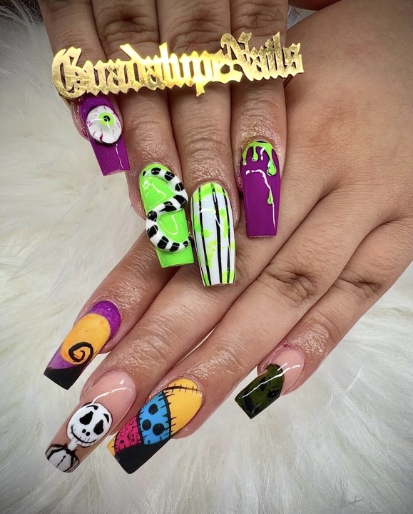 Coffin nails with Nightmare Before Christmas–inspired art in purple, green and orange