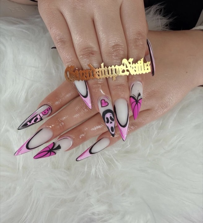 Stiletto nails with pink French outlines, pink hearts and Ghostface art